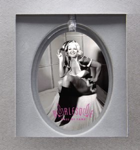 Holiday ornament featuring Jennie Lee in Santa costume