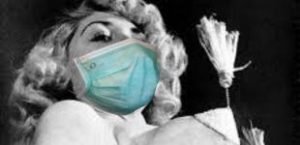 BHoF founder Jennie Lee spins tassels while wearing a medical face mask