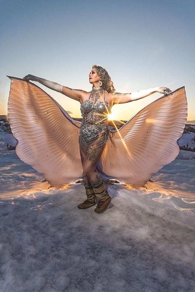 Stella Gams poses with Isis wings